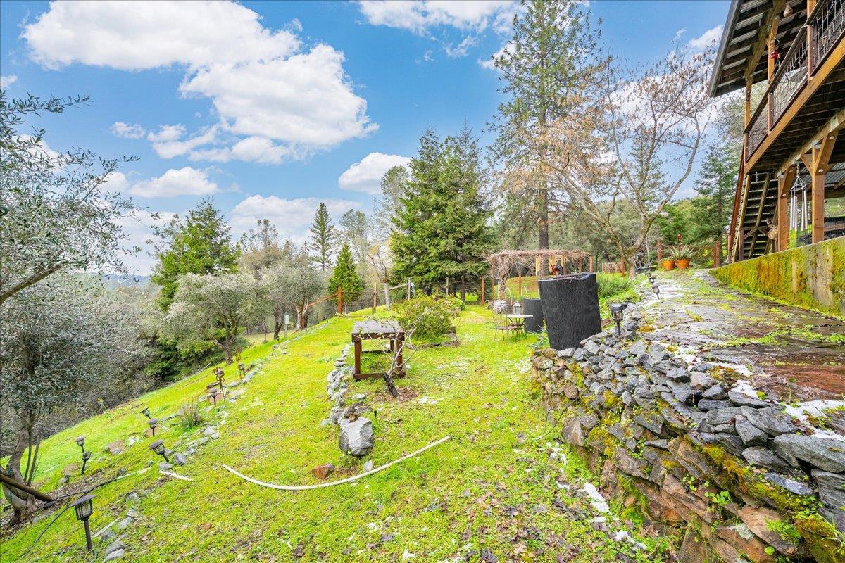 2244 Windmill Court Cool, CA 95614 - Photo 52 of 73 a view of a swimming pool with a yard
