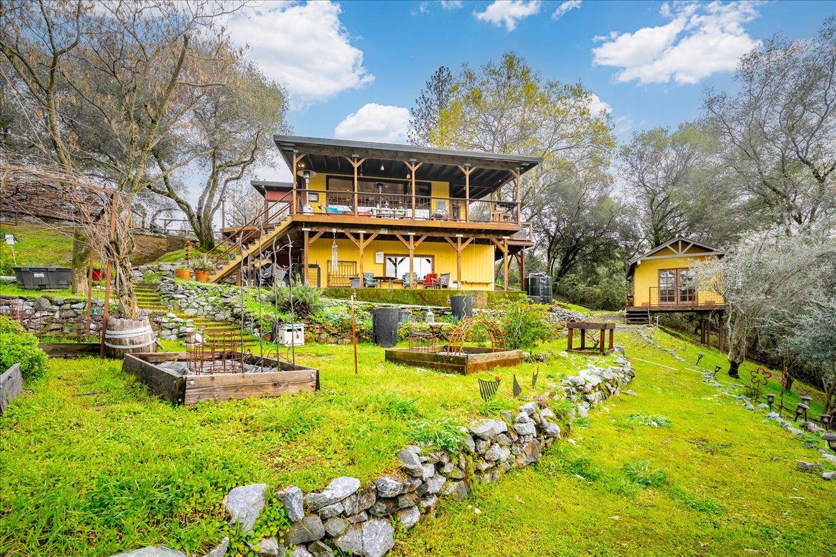 2244 Windmill Court Cool, CA 95614 - Photo 53 of 73 a front view of house with yard swimming pool and outdoor seating