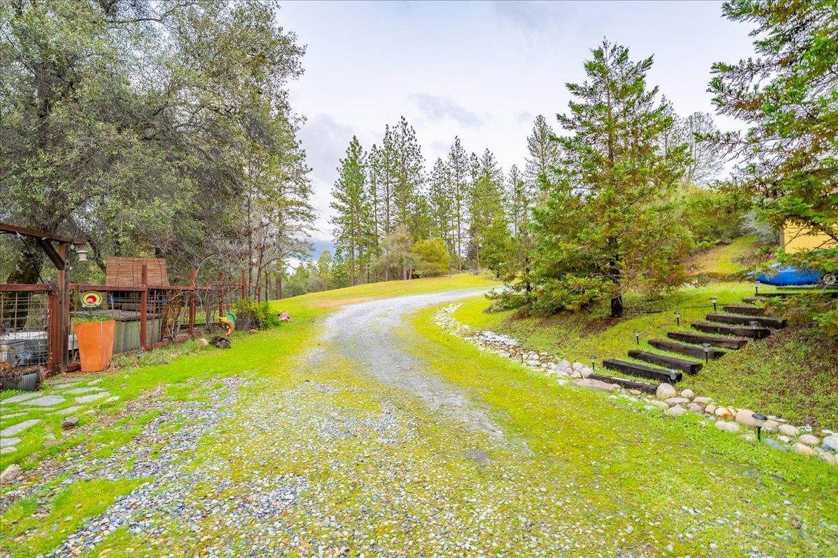 2244 Windmill Court Cool, CA 95614 - Photo 62 of 73 a view of a swimming pool with an outdoor space and seating area