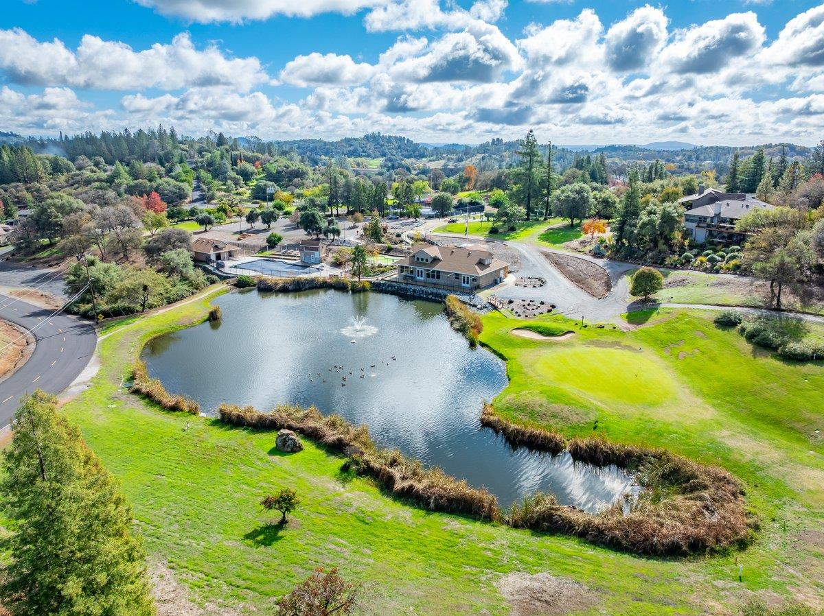 2244 Windmill Court Cool, CA 95614 - Photo 67 of 73 an aerial view of a house with swimming pool outdoor seating and yard