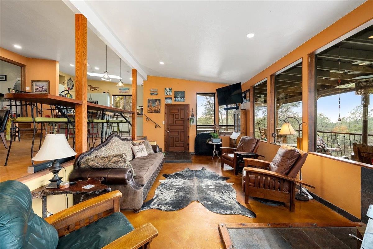 2244 Windmill Court Cool, CA 95614 - Photo 10 of 73 a living room with furniture kitchen view and large windows
