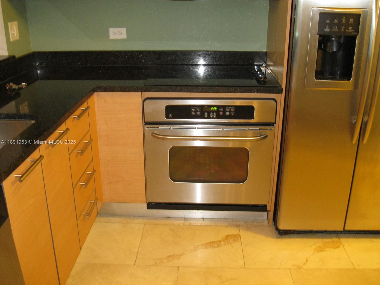 31 Southeast 5th Street, Unit 1210 Miami, FL 33131 - Photo 14 of 26 a stove top oven sitting inside of a kitchen
