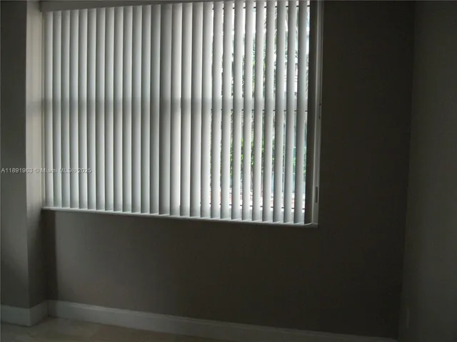 a view of backyard with swimming pool and outdoor seating