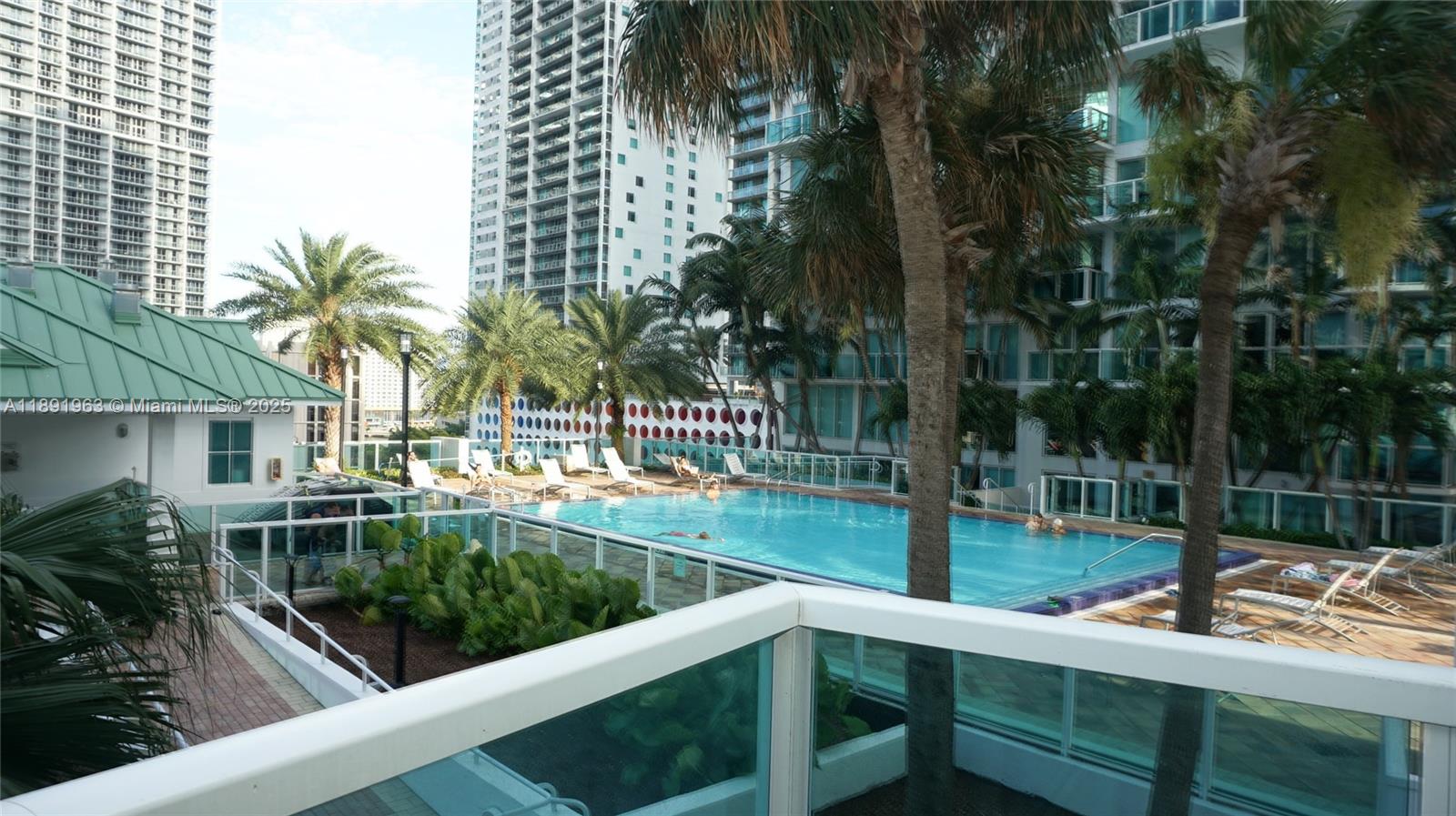 31 Southeast 5th Street, Unit 1210 Miami, FL 33131 - Photo 26 of 26 a view of backyard with swimming pool and outdoor seating