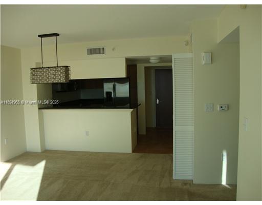 31 Southeast 5th Street, Unit 1210 Miami, FL 33131 - Photo 4 of 26 a view of a living room with a sink