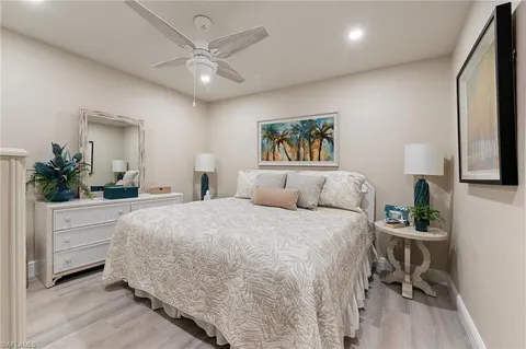 a bathroom with a toilet sink shower and mirror