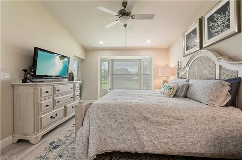 a bathroom with a double vanity sink mirror and shower