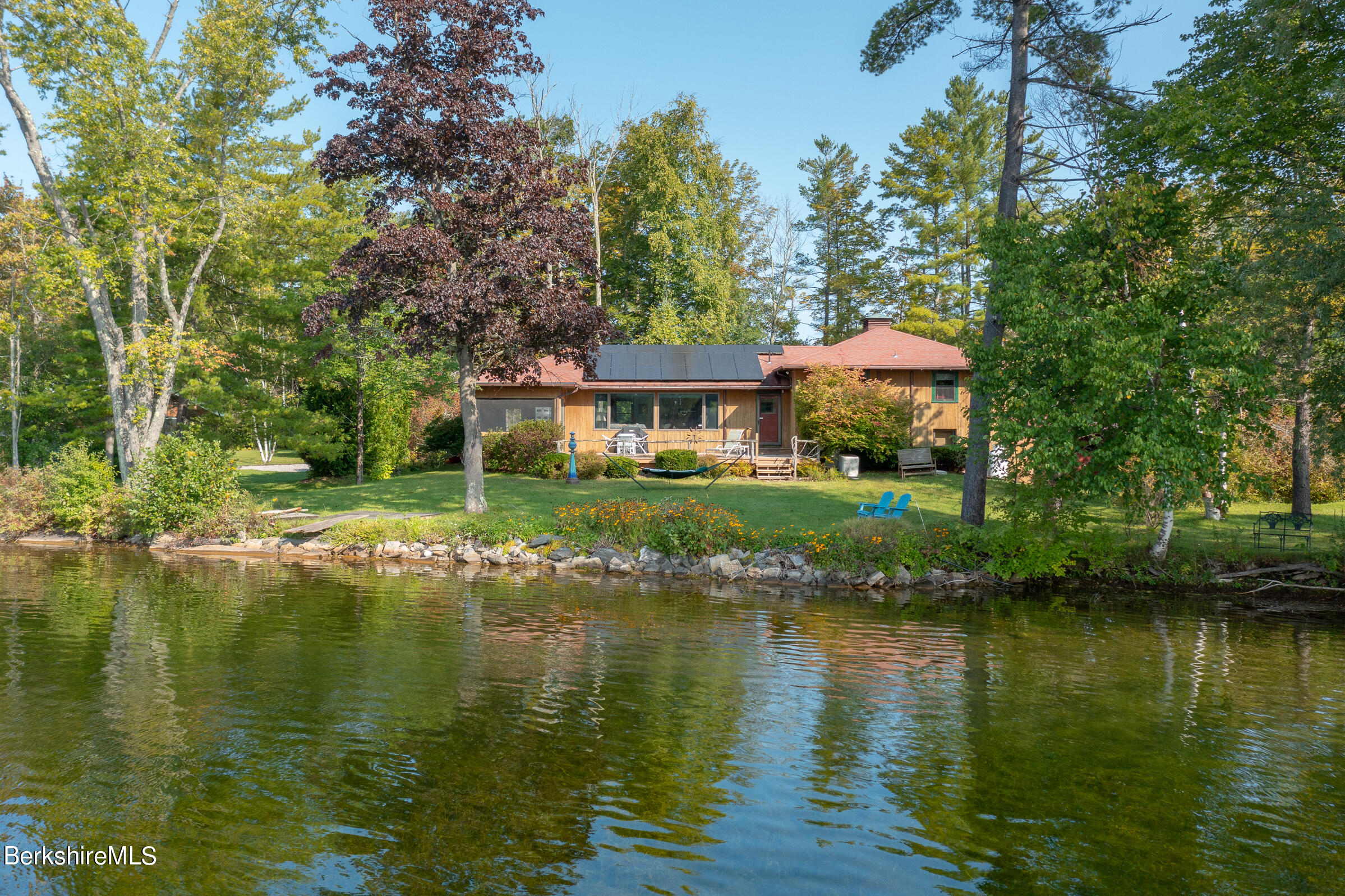 a front view of a house with a lake view