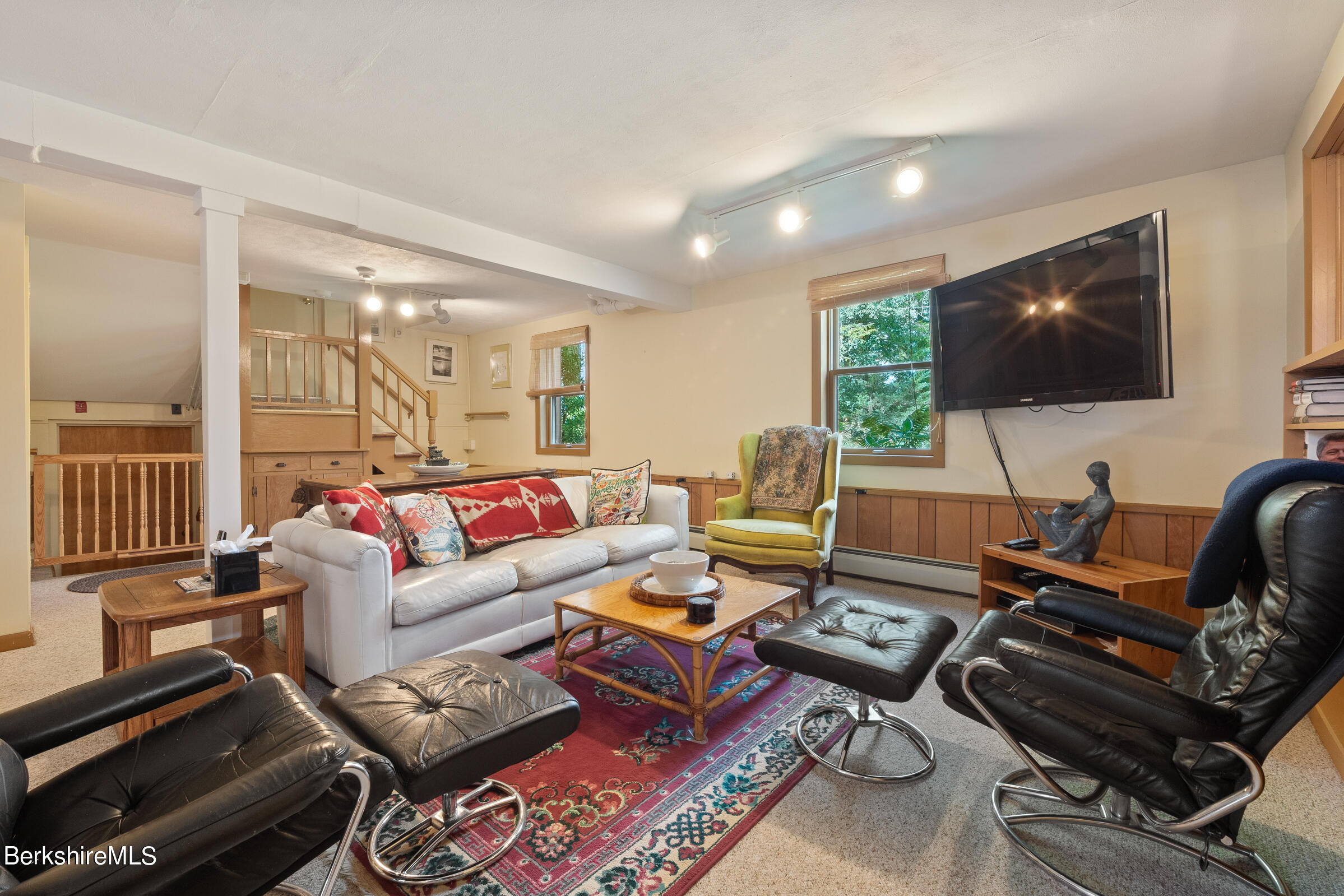 61 Bramble Lane Lenox, MA 01240 - Photo 11 of 42 a living room with furniture and a flat screen tv