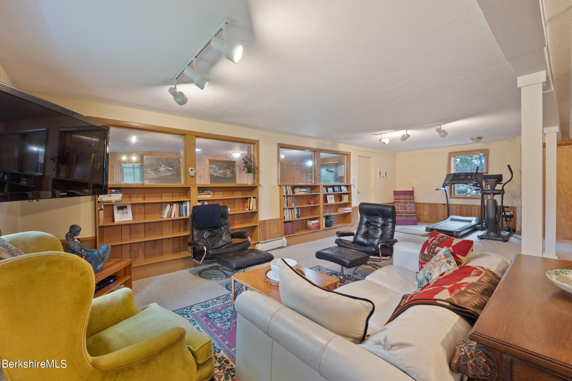 61 Bramble Lane Lenox, MA 01240 - Photo 12 of 42 a living room with furniture kitchen view and a large window