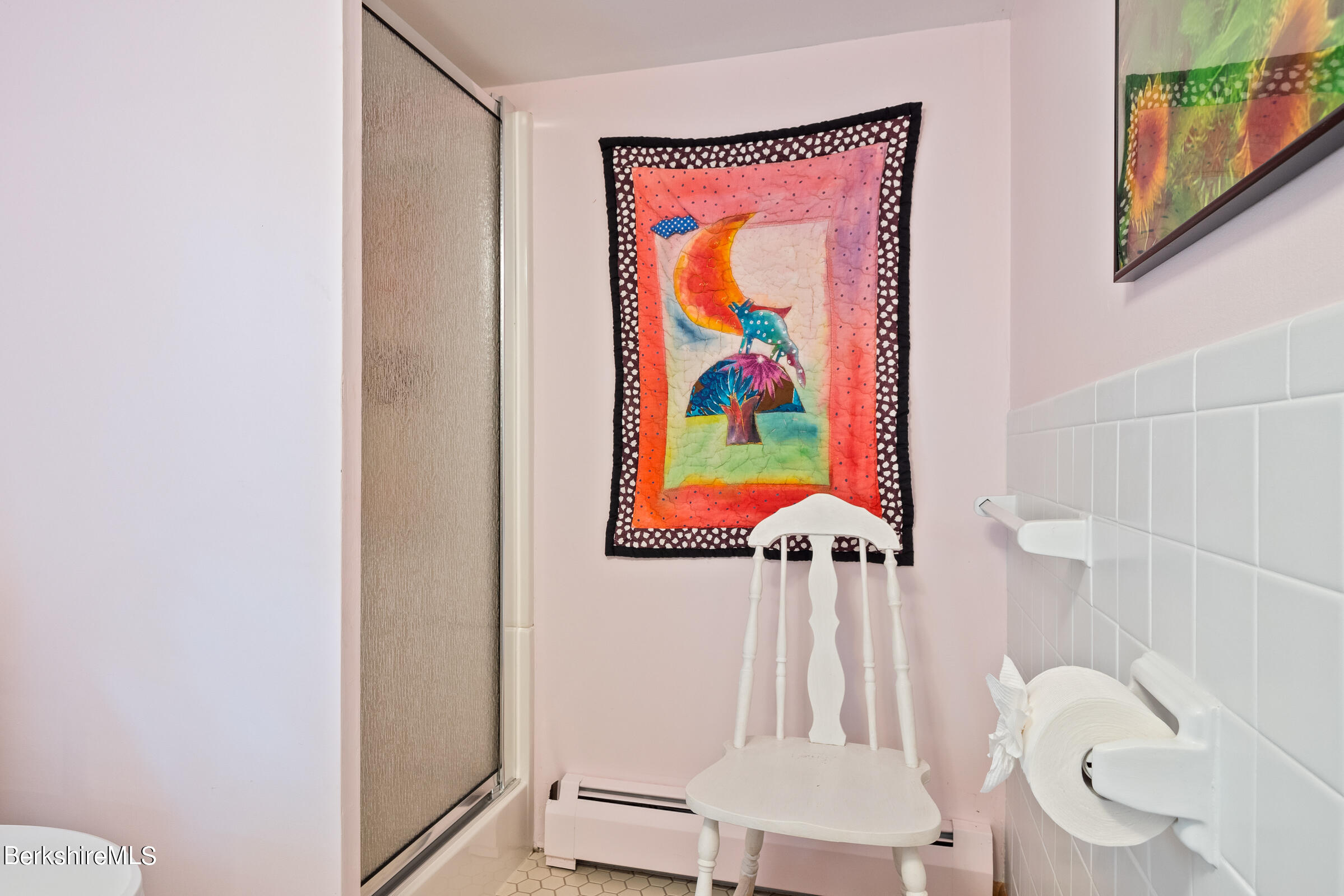 61 Bramble Lane Lenox, MA 01240 - Photo 13 of 42 a bathroom with a sink a toilet and painting on the wall