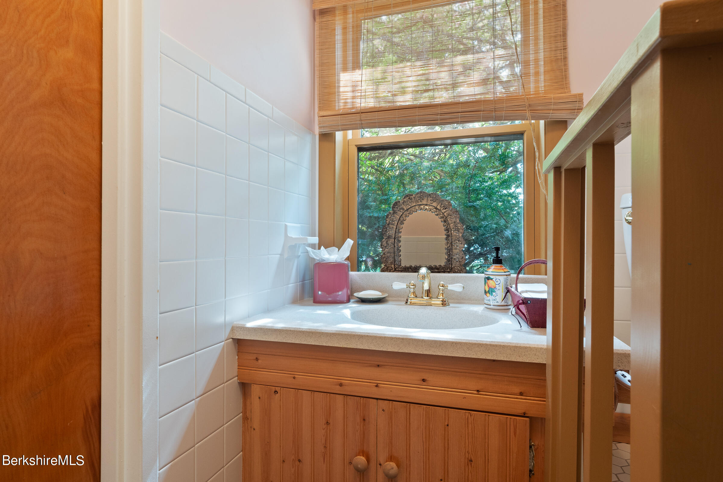 61 Bramble Lane Lenox, MA 01240 - Photo 14 of 42 a bathroom with a sink and a mirror