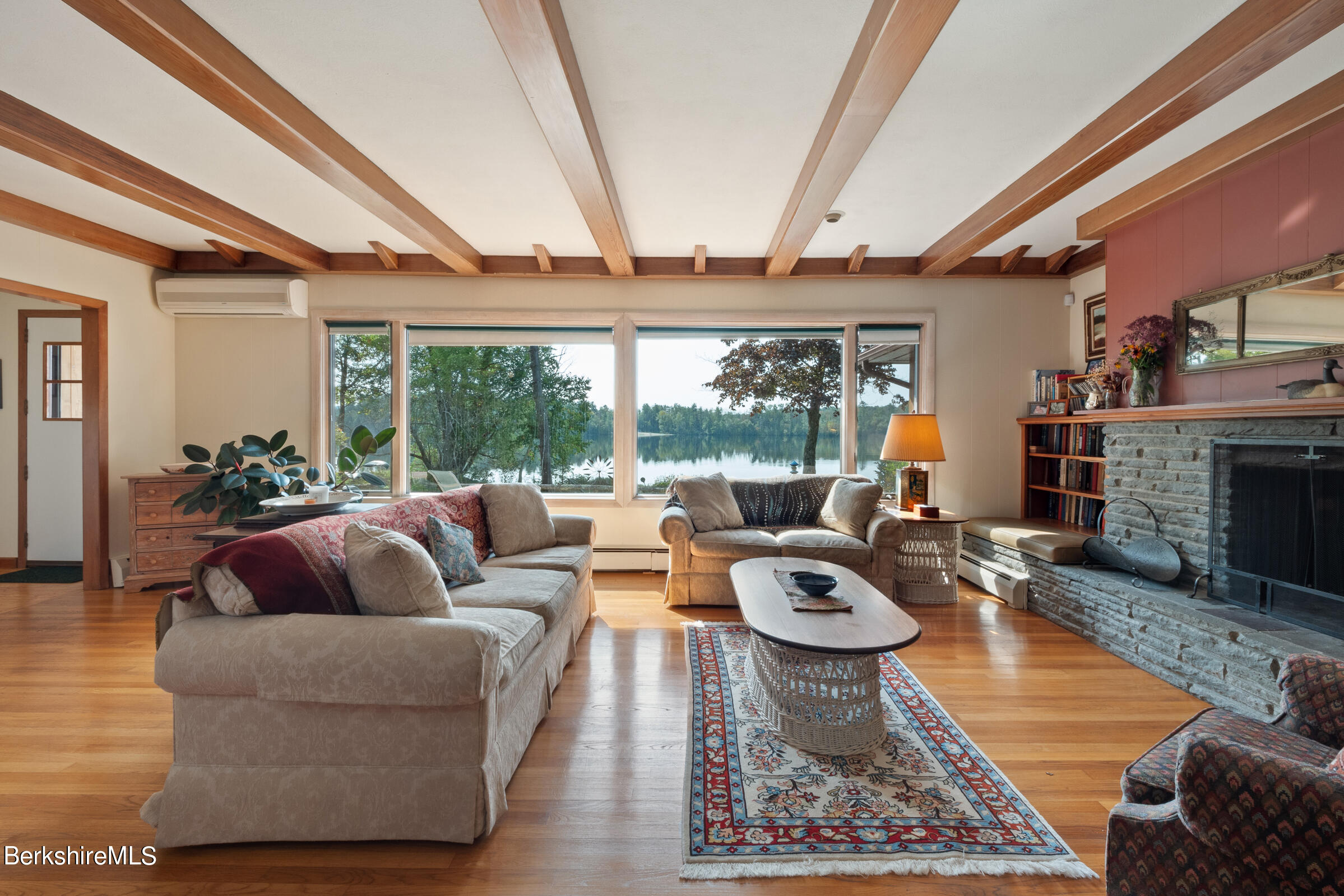61 Bramble Lane Lenox, MA 01240 - Photo 15 of 42 a living room with fireplace furniture and a large window