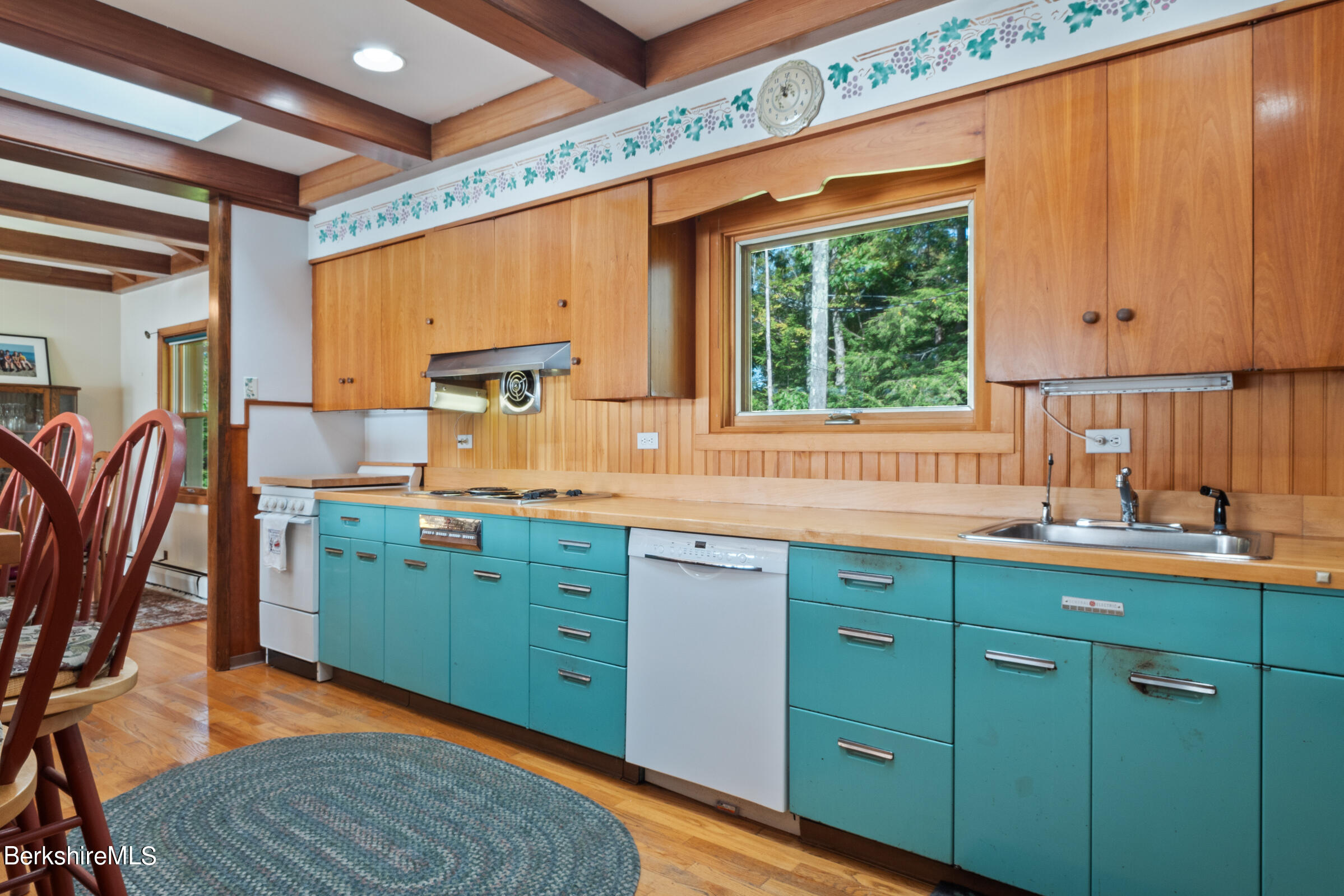61 Bramble Lane Lenox, MA 01240 - Photo 19 of 42 a kitchen with cabinets a sink and appliances
