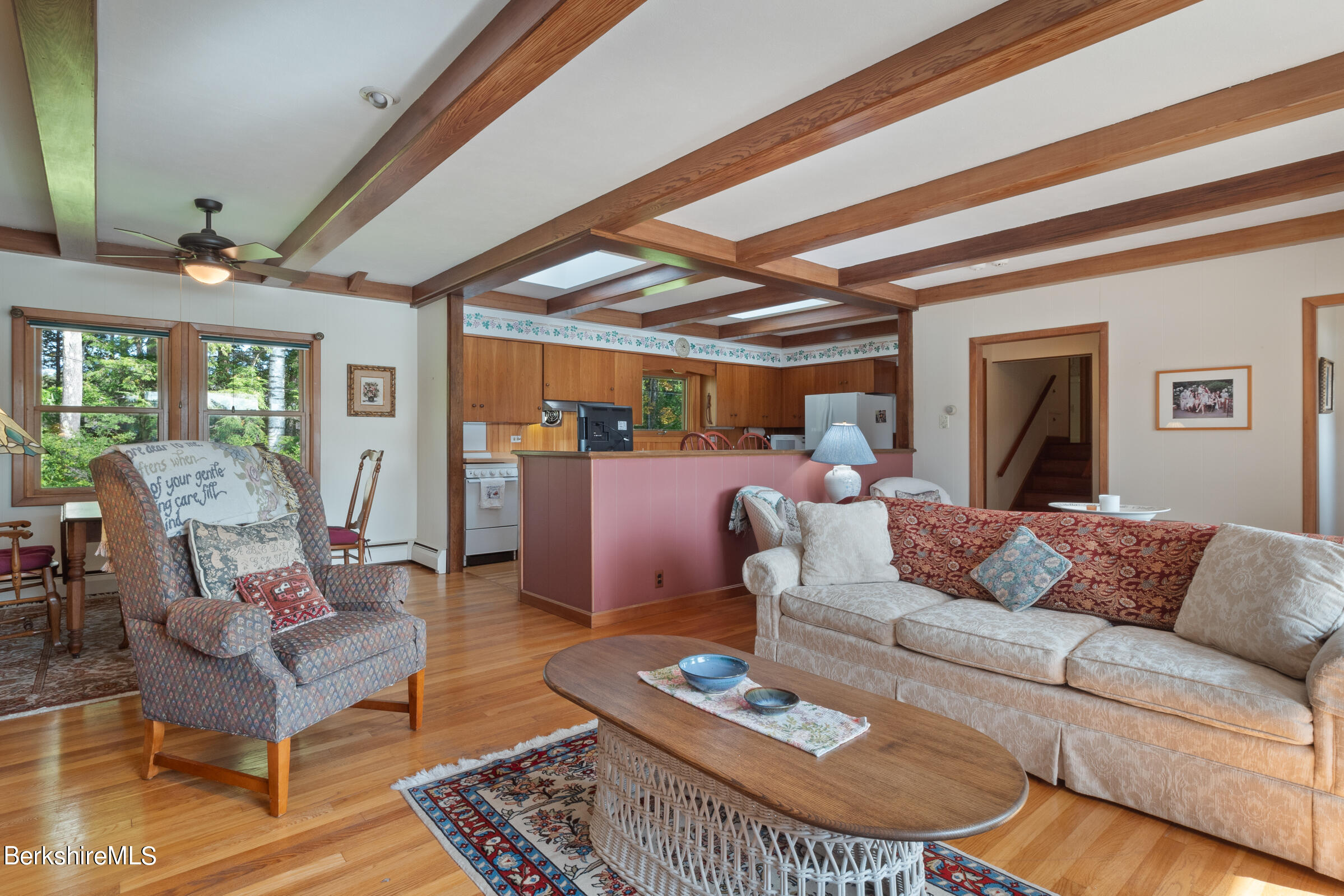 61 Bramble Lane Lenox, MA 01240 - Photo 21 of 42 a living room with furniture and a chandelier
