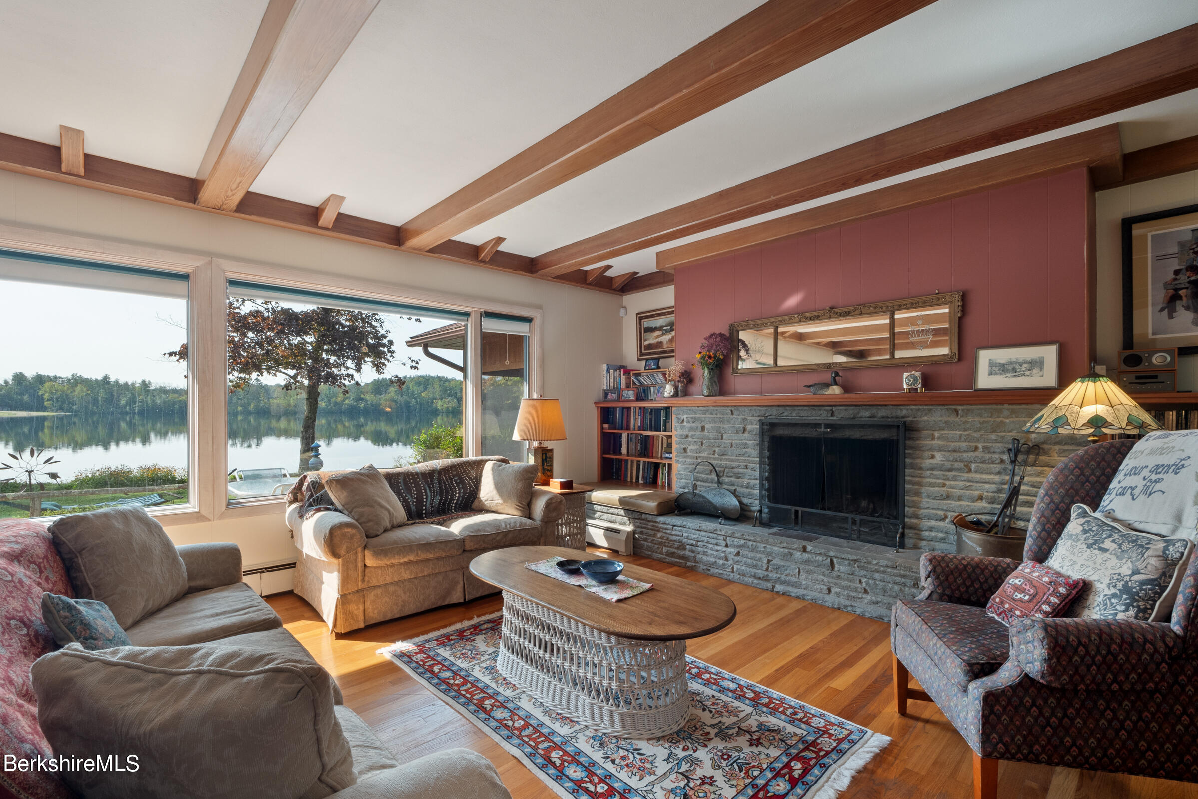 61 Bramble Lane Lenox, MA 01240 - Photo 23 of 42 a living room with furniture and a fireplace