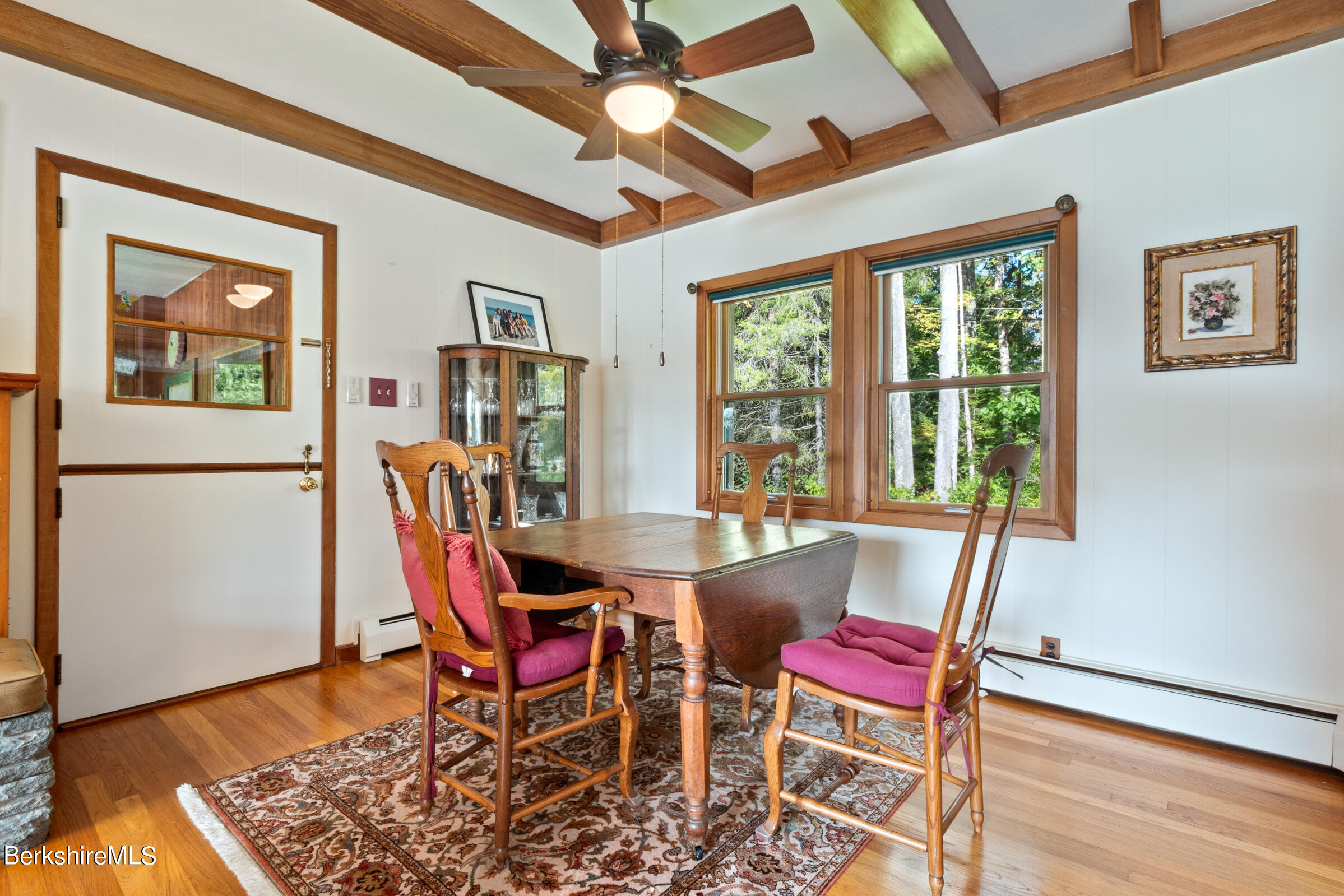 61 Bramble Lane Lenox, MA 01240 - Photo 25 of 42 a dining room with furniture and wooden floor