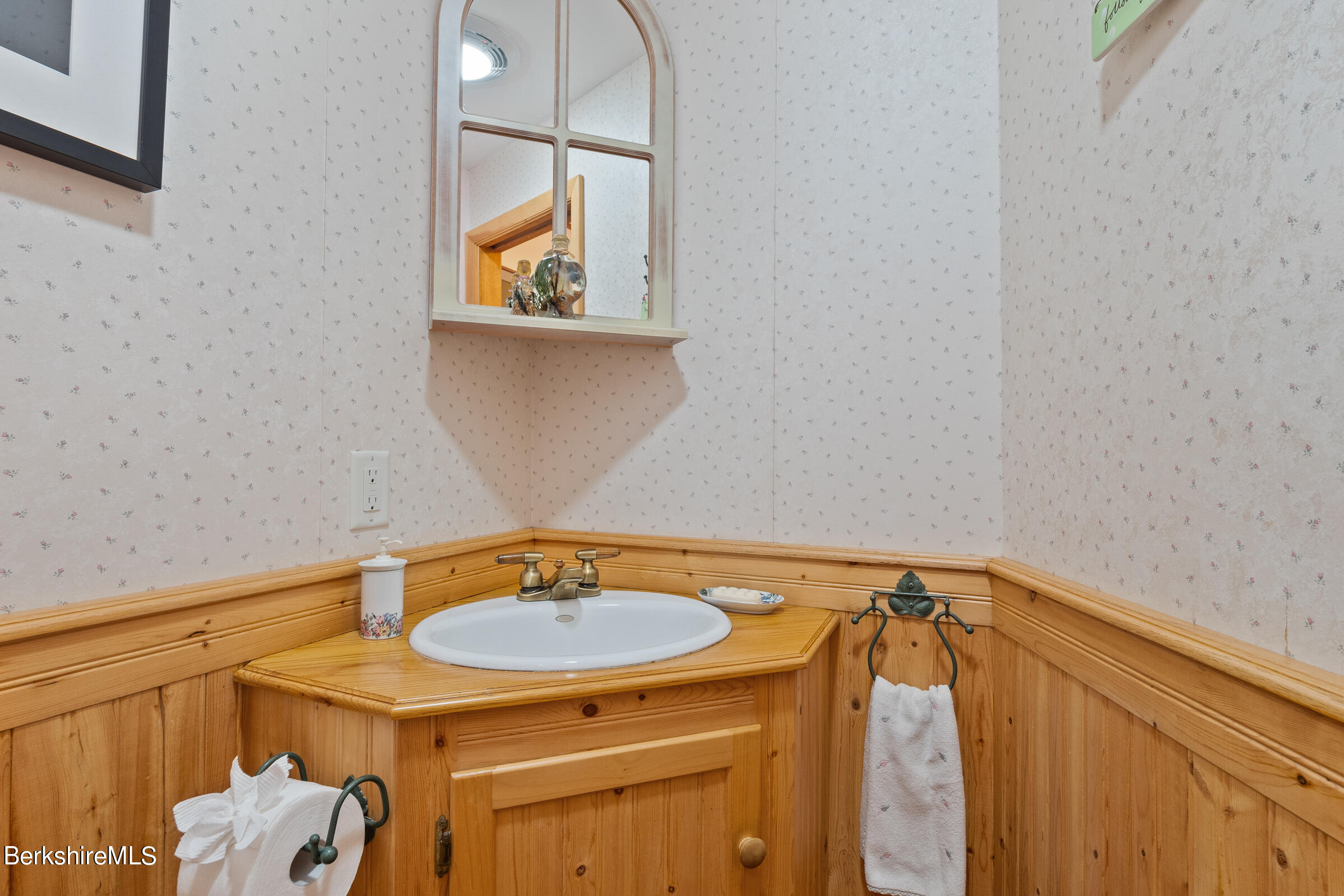 61 Bramble Lane Lenox, MA 01240 - Photo 26 of 42 a bathroom with a sink and a mirror