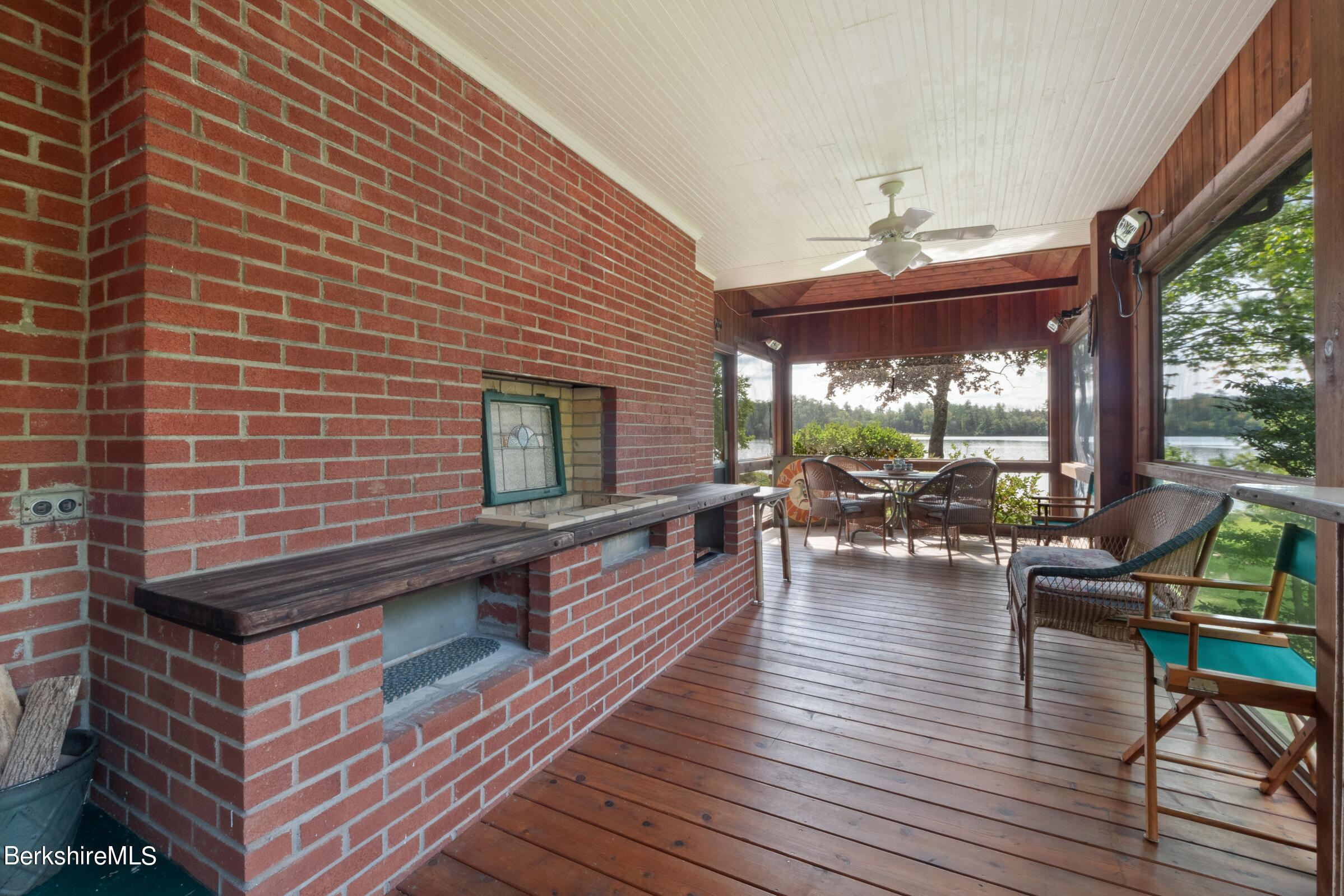 61 Bramble Lane Lenox, MA 01240 - Photo 28 of 42 a view of a patio with dining table and chairs