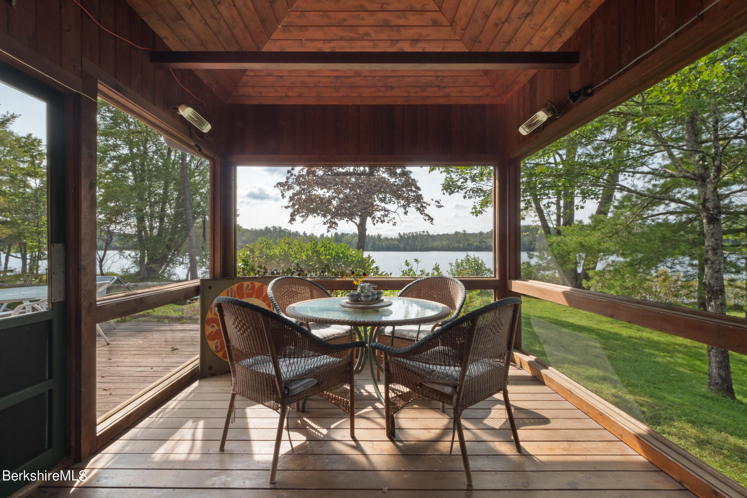 61 Bramble Lane Lenox, MA 01240 - Photo 29 of 42 a view of a porch with furniture and wooden floor