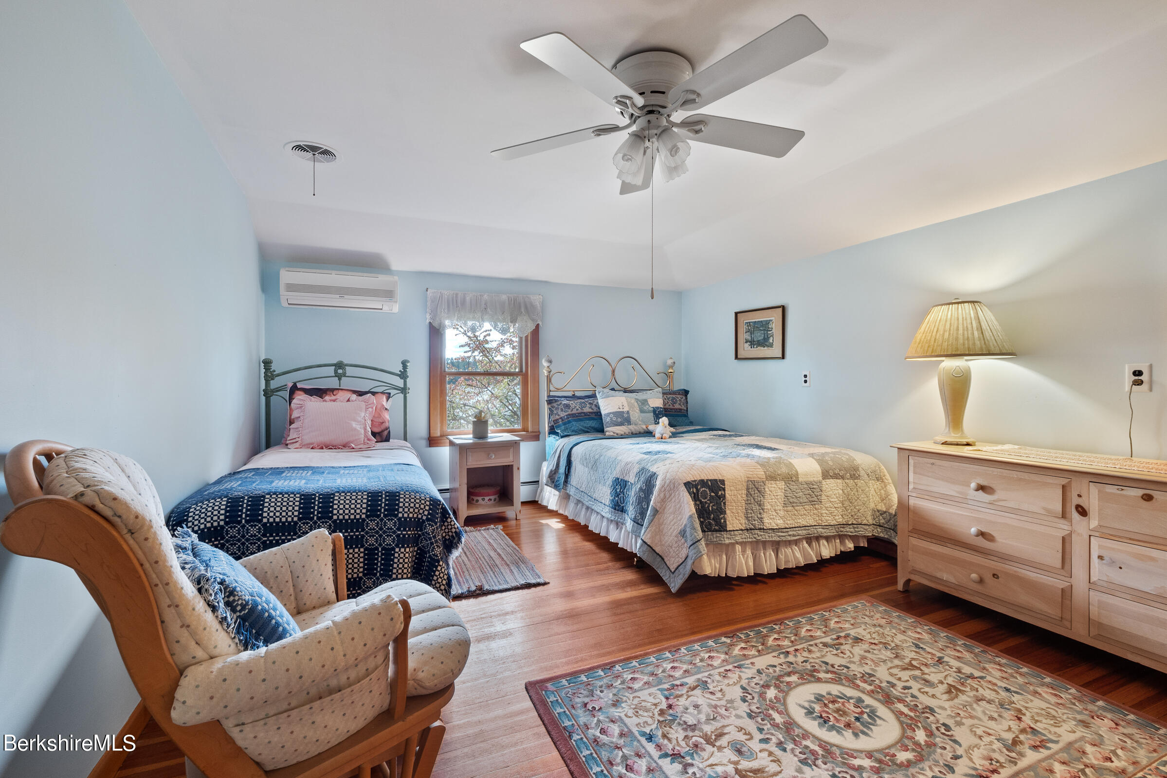 61 Bramble Lane Lenox, MA 01240 - Photo 37 of 42 a bedroom with a bed and wooden floor