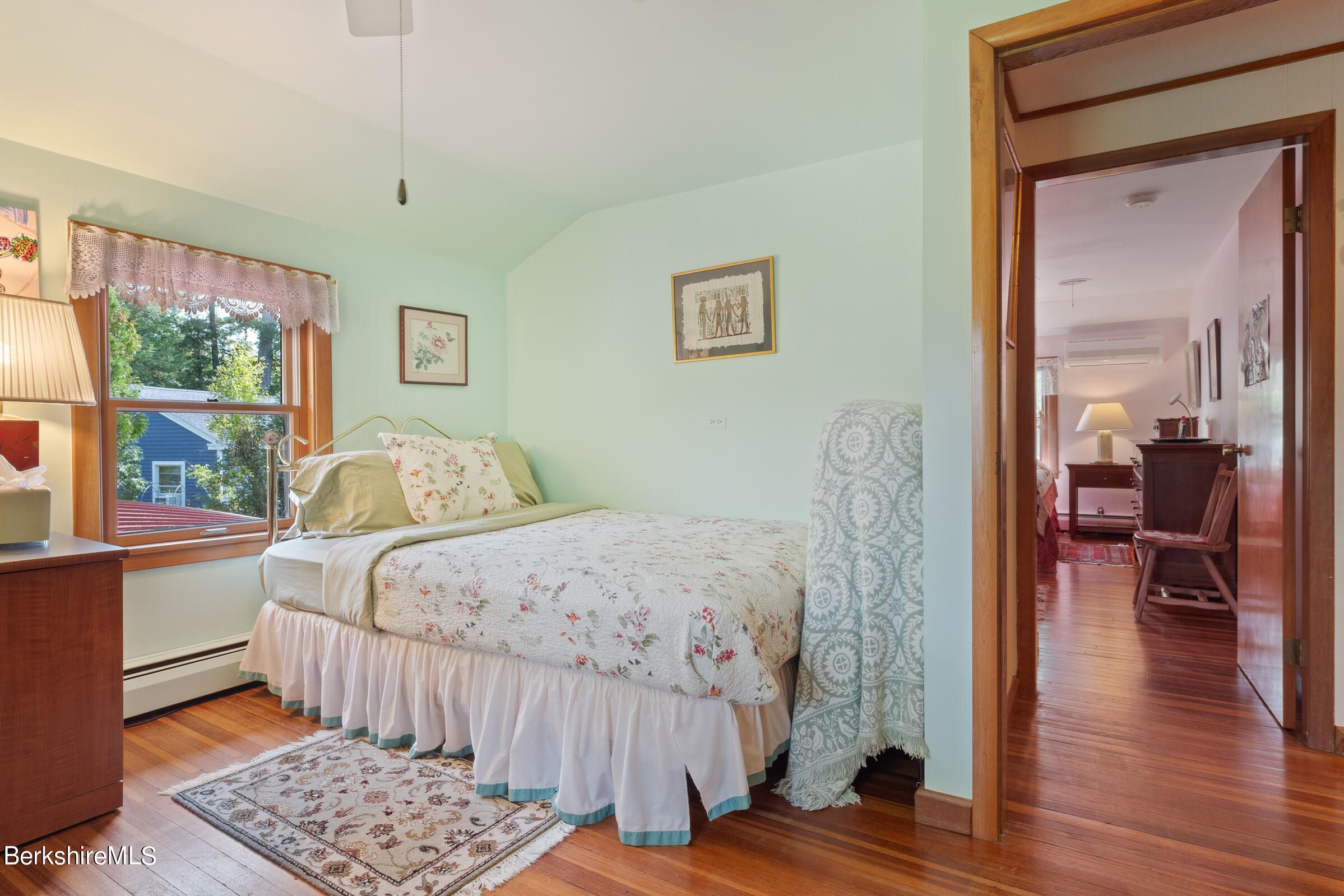 61 Bramble Lane Lenox, MA 01240 - Photo 39 of 42 a bedroom with a bed and wooden floor