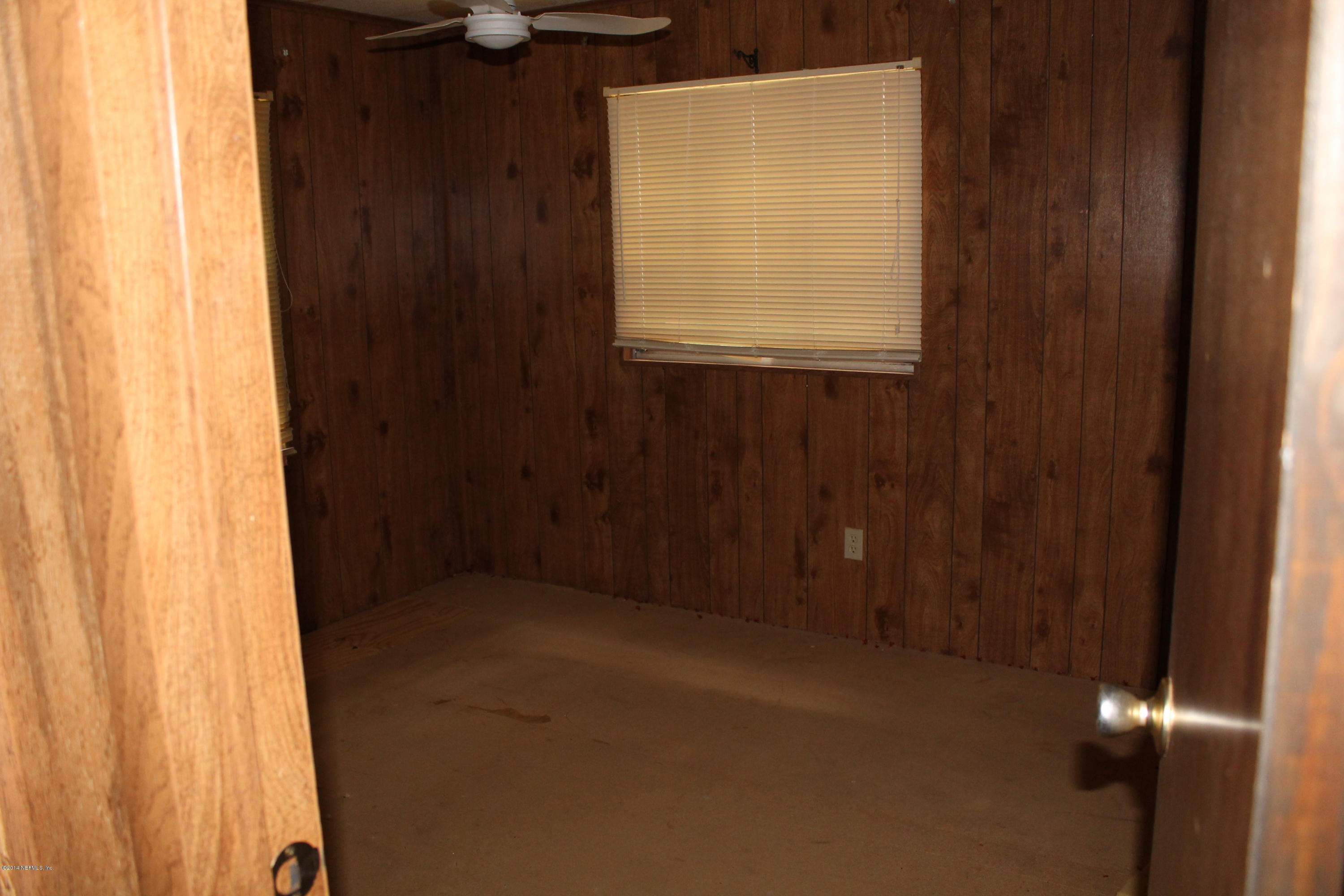5700 Datil Pepper Road St. Augustine, FL 32086 - Photo 16 of 17 a view of an empty room with a window