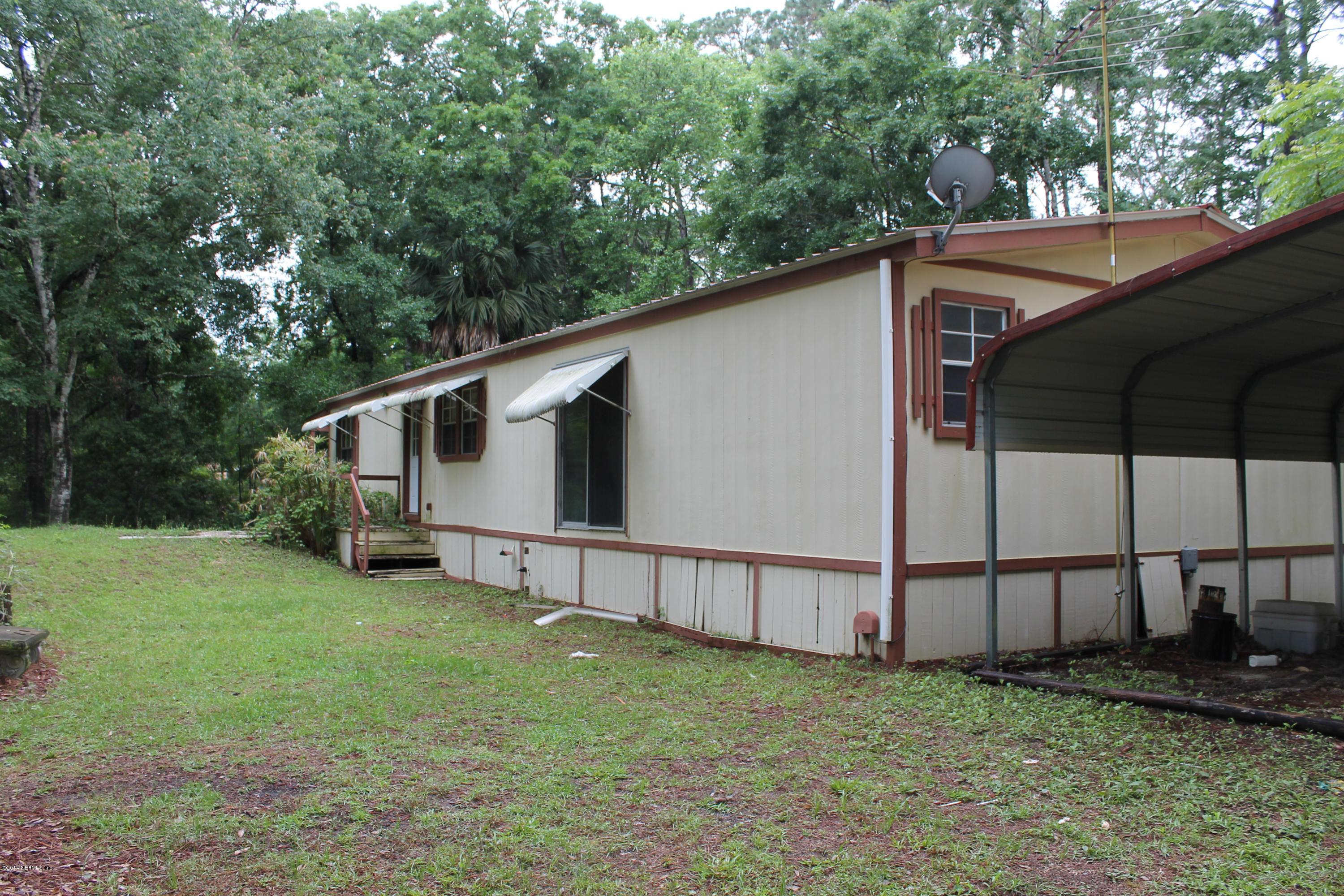 5700 Datil Pepper Road St. Augustine, FL 32086 - Photo 6 of 17 a backyard of a house with lots of green space