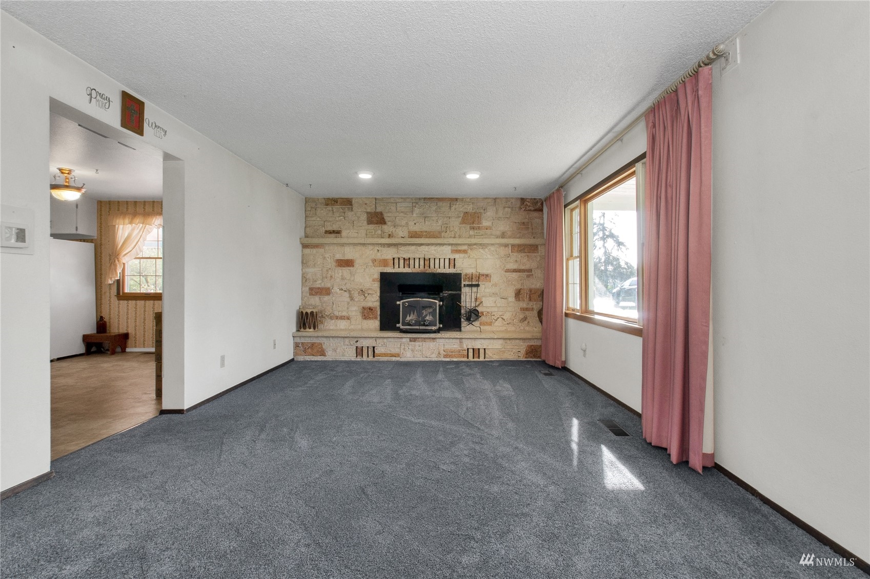 12128 Hunter Loop Road Southwest Rochester, WA 98579 - Photo 11 of 31 a view of a livingroom with a fireplace and window