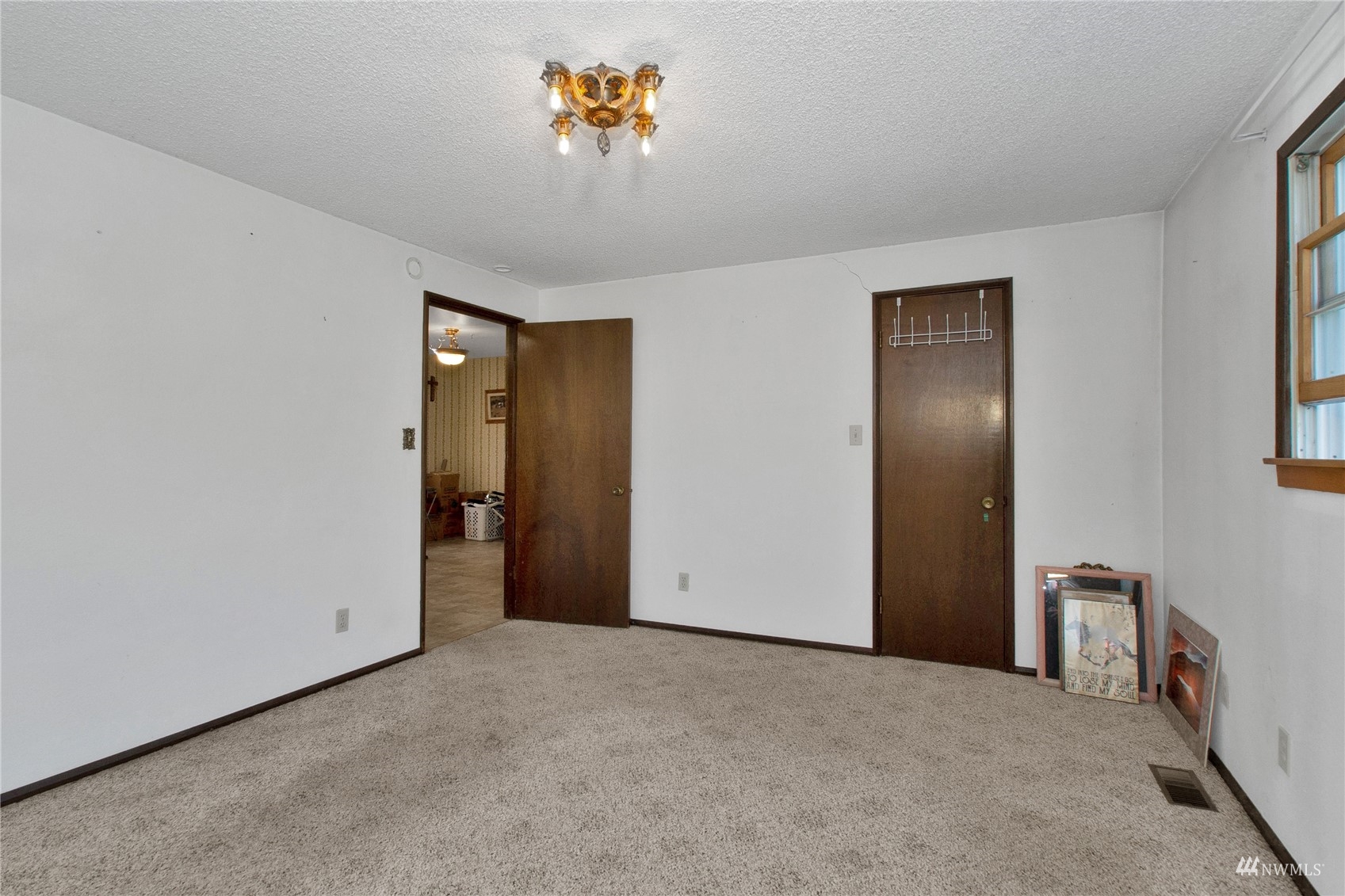 12128 Hunter Loop Road Southwest Rochester, WA 98579 - Photo 14 of 31 a view of an empty room with a window