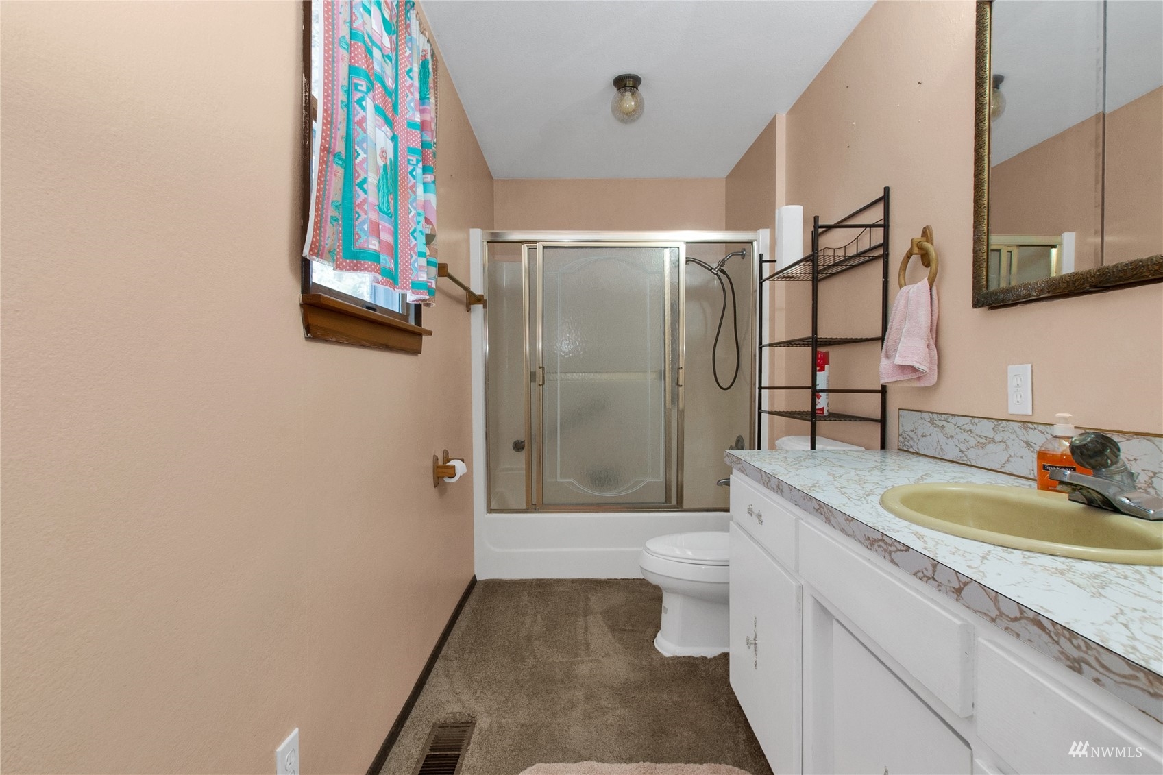 12128 Hunter Loop Road Southwest Rochester, WA 98579 - Photo 15 of 31 a bathroom with a sink a toilet and shower