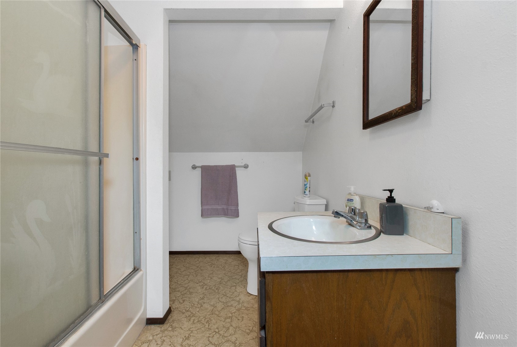 12128 Hunter Loop Road Southwest Rochester, WA 98579 - Photo 20 of 31 a bathroom with a sink and a mirror