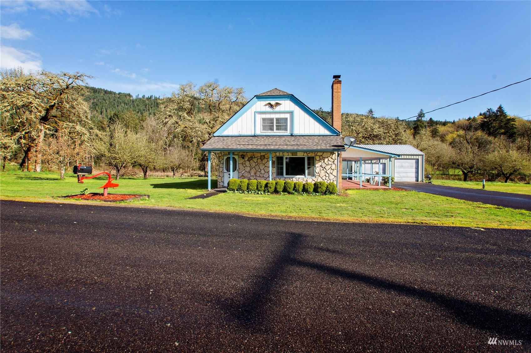 12128 Hunter Loop Road Southwest Rochester, WA 98579 - Photo 2 of 31 a view of an house with a big yard
