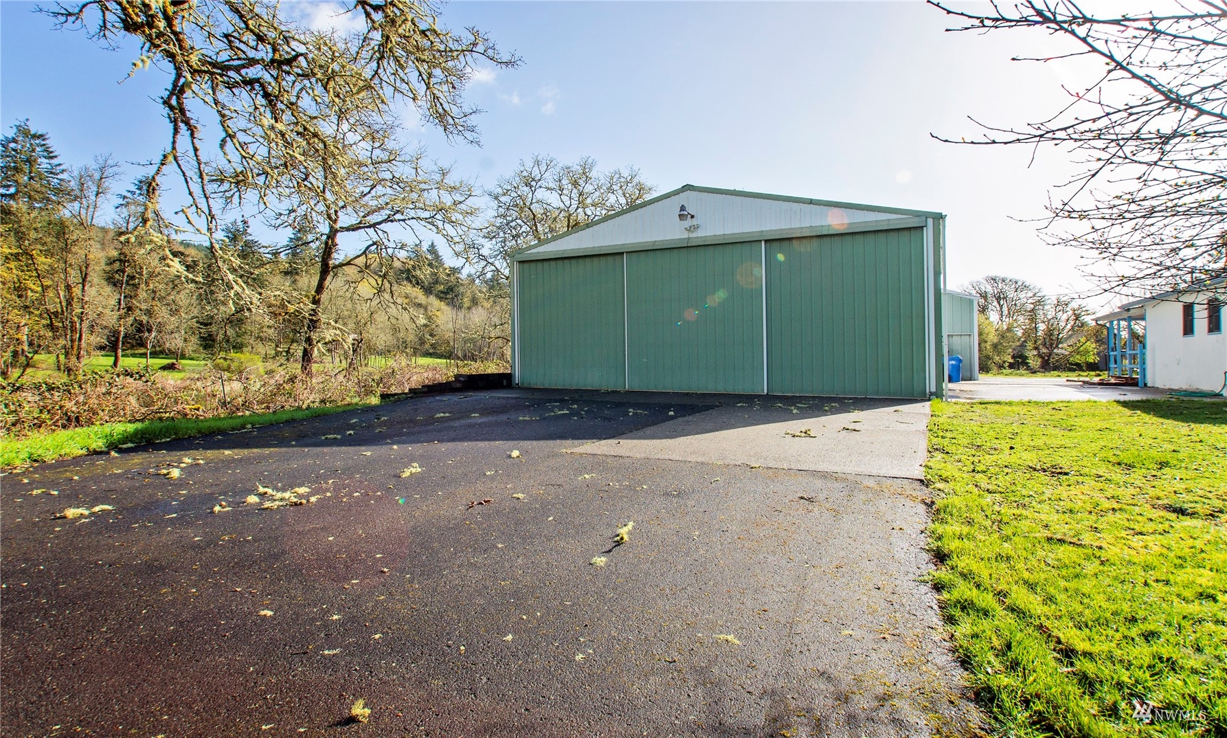 12128 Hunter Loop Road Southwest Rochester, WA 98579 - Photo 27 of 31 a view of a yard with a house