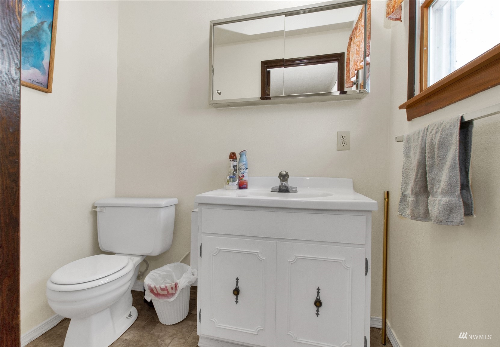 12128 Hunter Loop Road Southwest Rochester, WA 98579 - Photo 8 of 31 a bathroom with a sink toilet and mirror