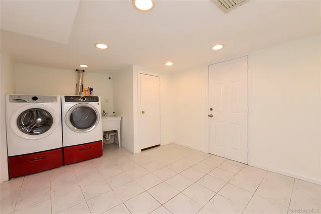 a utility room with dryer and washer