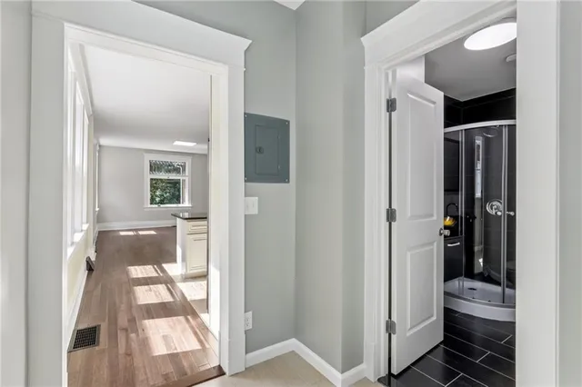 a view of bathroom with bathtub and shower