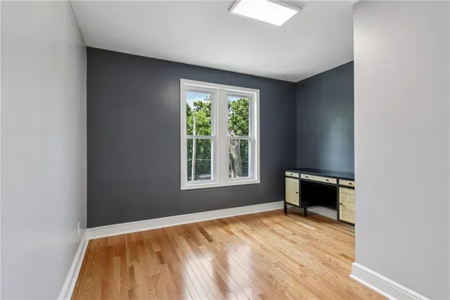 a view of an empty room with a window