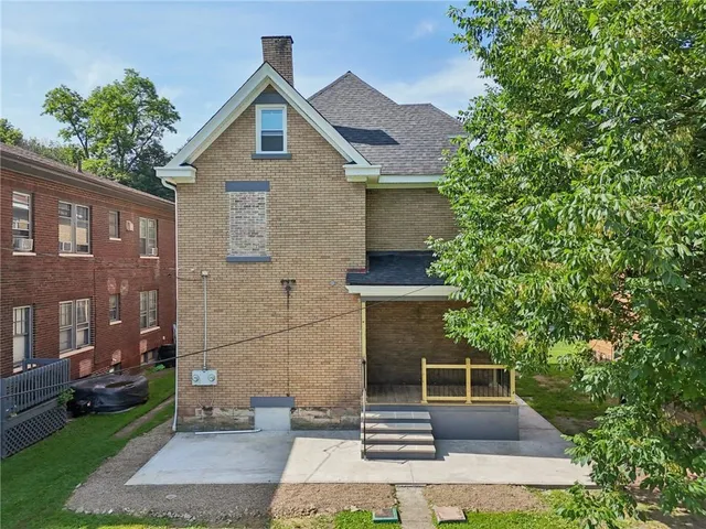 an aerial view of residential house with outdoor space and swimming pool