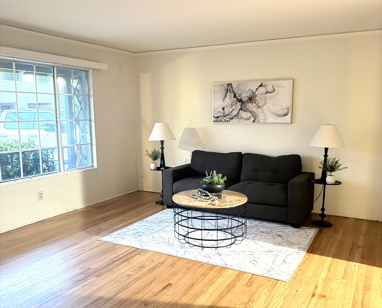 440 West 7th Street Gilroy, CA 95020 - Photo 2 of 6 a living room with furniture and a wooden floor