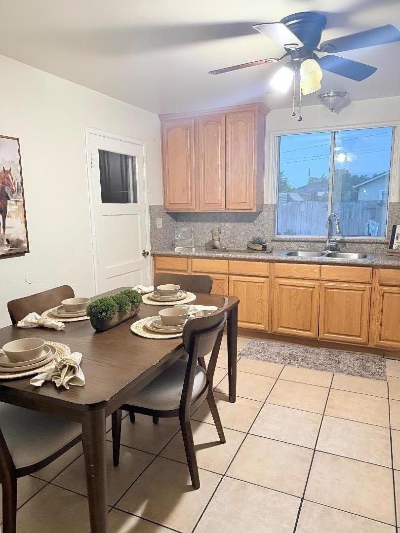 440 West 7th Street Gilroy, CA 95020 - Photo 3 of 6 a kitchen with a table and chairs in it