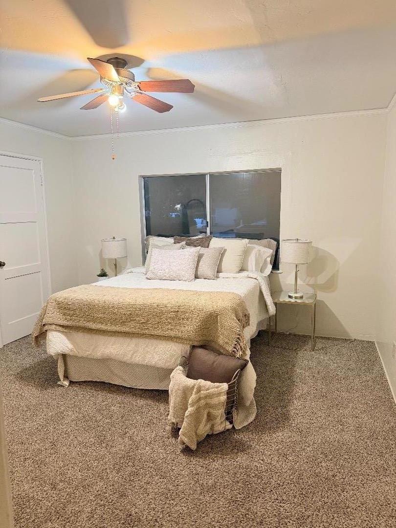 440 West 7th Street Gilroy, CA 95020 - Photo 6 of 6 a bedroom with a bed and a lamp