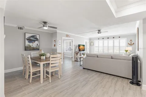 a kitchen with stainless steel appliances granite countertop a refrigerator sink and stove