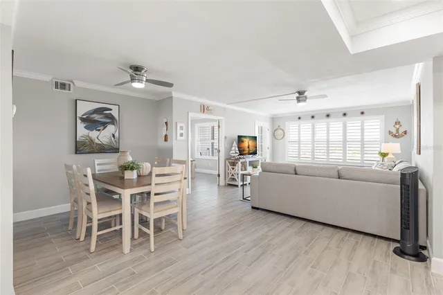 a kitchen with stainless steel appliances granite countertop a refrigerator sink and stove