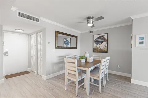 a spacious bedroom with a bed and wooden floor
