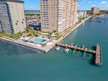 a view of a swimming pool with sitting area