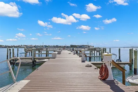a view of a swimming pool with outdoor seating
