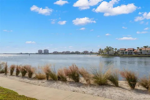 a view of a tall building with a water view