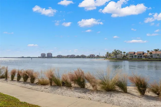a view of a tall building with a water view