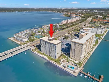 a view of a lake with couches and city view